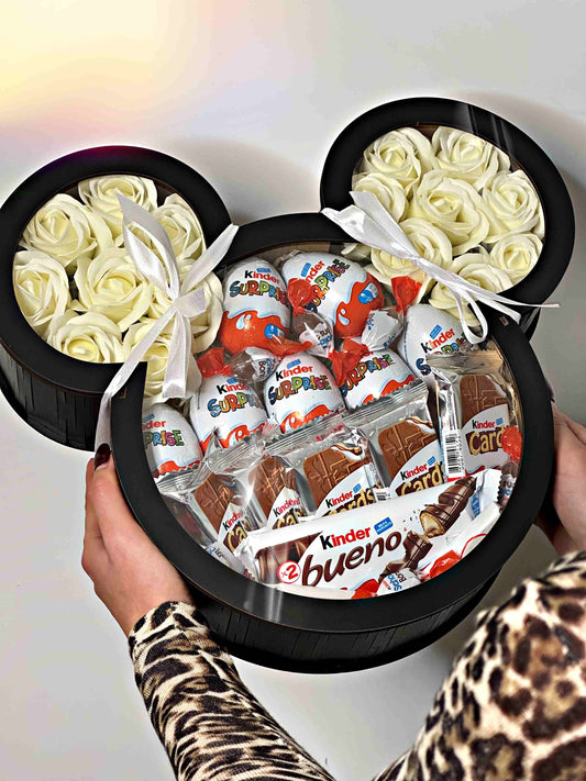 Mickey Mouse-shaped gift box featuring 16 elegant soap roses and a selection of Kinder sweets, including Kinder Bueno, Kinder Cards, Kinder Eggs, and Schoko Bons. Perfect for gifting on special occasions like birthdays, anniversaries, and romantic events, combining charm and sweet indulgence.