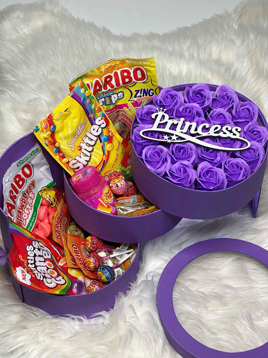 Three-tiered purple gift box featuring soap roses, Haribo Tangfastic Minis, and Skittles Smoothies. A colorful and sweet gift for any occasion.