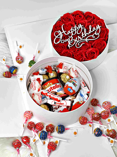 Two-tier gift box featuring 21 soap roses, 22 Chupa Chups, and a selection of premium sweets, including Raffaello and Kinder chocolates. Perfect for celebrations and special moments.